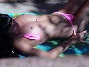 Voyeur pics of a hot brunette topless sunbathing - 15 voyeur Pictures